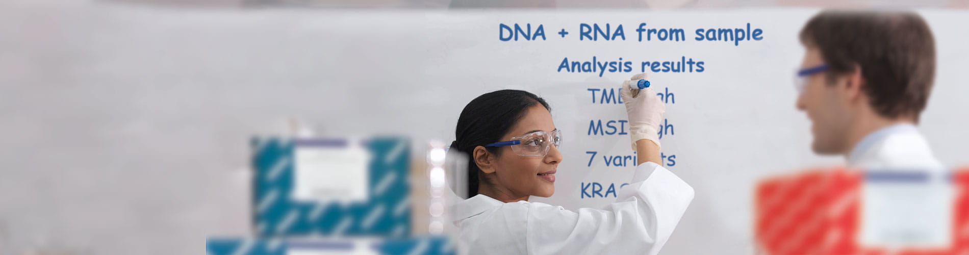 Scientists writing on a board